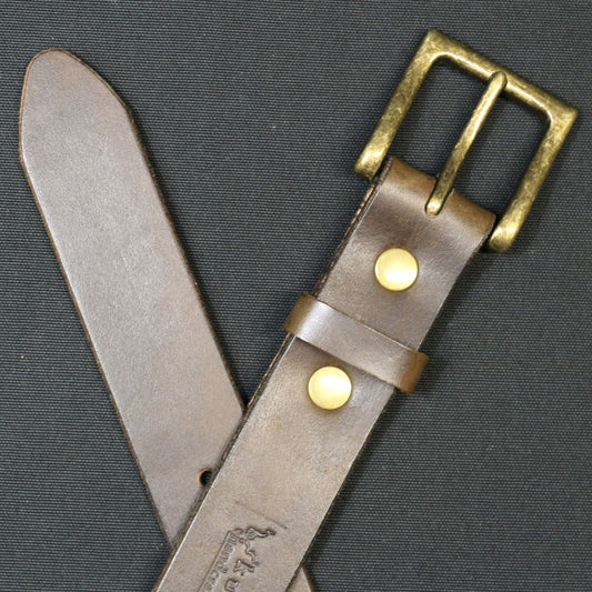 a brown leather belt with antique brass buckle and rivets